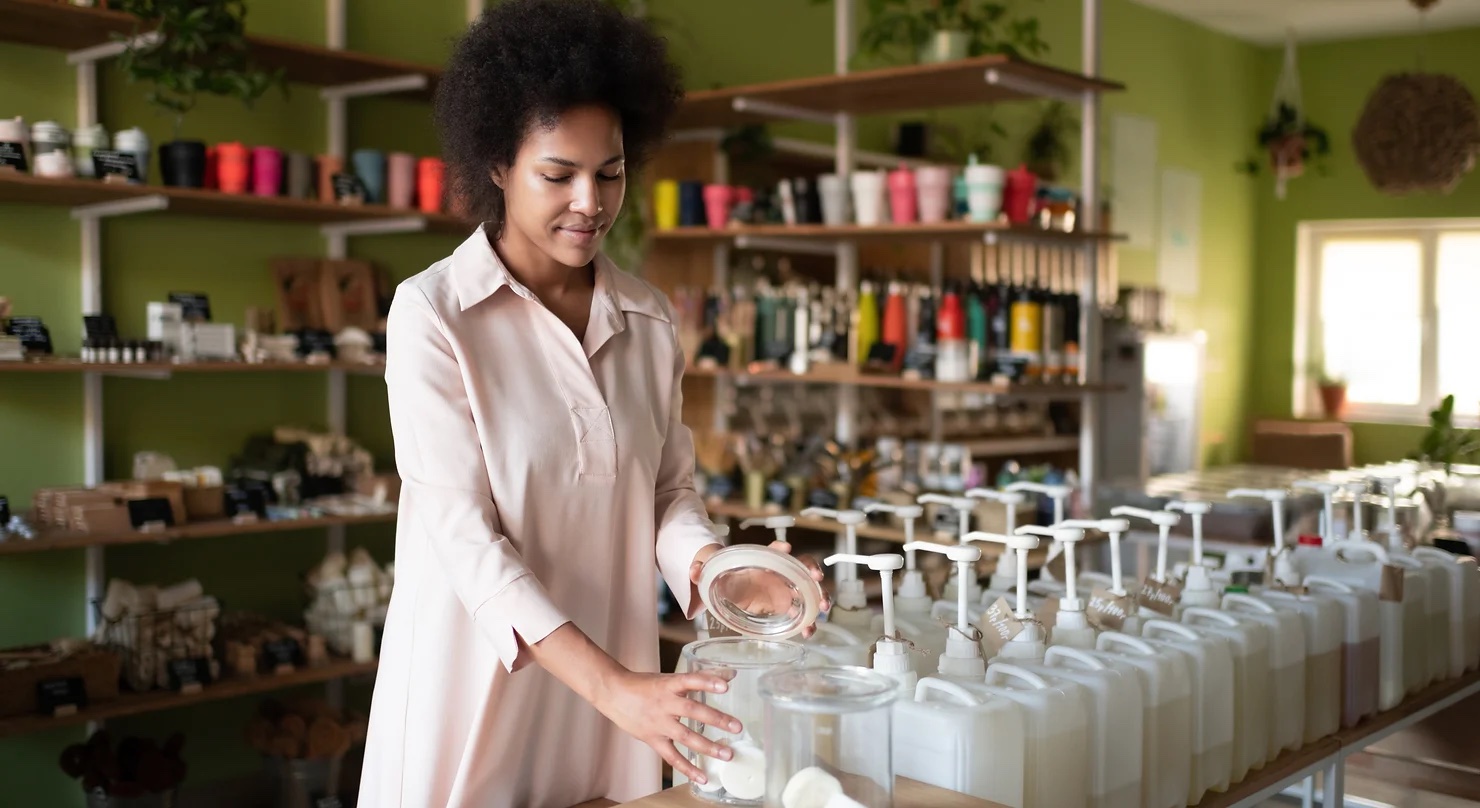 woman preparing retail product marketing in a store