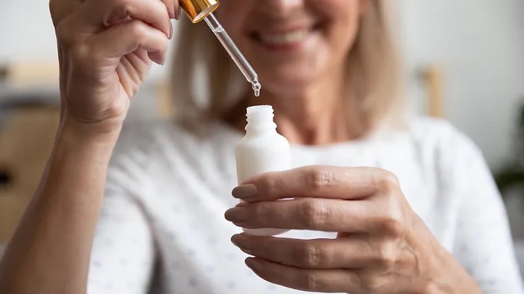 women using skincare product
